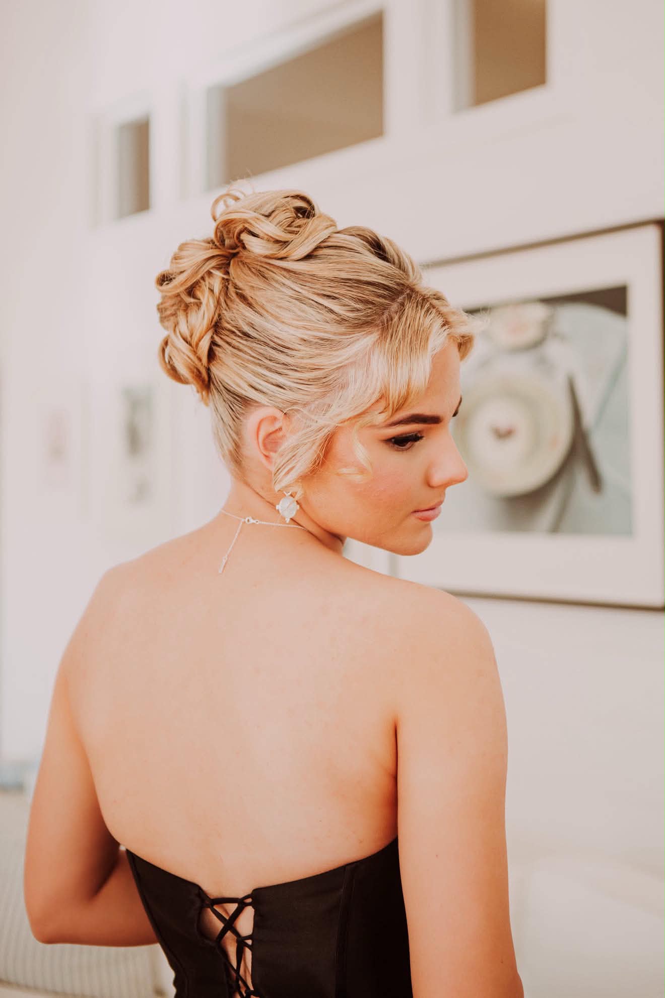 Back view of a pinned curl formal upstyle