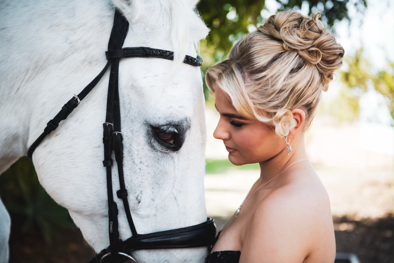Chelsea's formal upstyle styled by My Place Hair & Beauty, pictured with a white horse